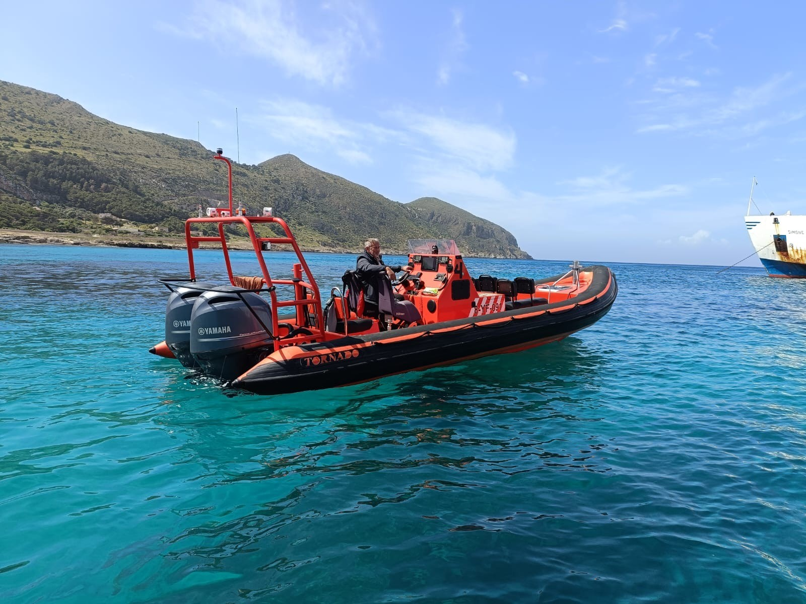 Professional orange RIB operating at sea